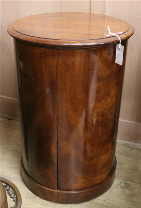 A mid 19th century mahogany cylindrical commode, with lifting top and two doors and covered section, height 74cm